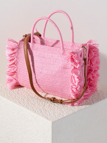 Make your outfit pop with Shiraleah's Sarah Mini Tote handbag. Made from woven paper straw in a soft pink color, this bag is the perfect accessory to bring on a picnic or for a night out! Featuring chic circular top handles, the detachable, adjustable cross-body strap allows for versatility in your style. Pair with other items from Shiraleah to complete your look!
