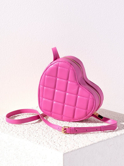 Carry a little bit of love wherever your go with Shiraleah's Sweetheart Cross Body Bag. Made from durable quilted nylon with an adjustable cross-body strap, this versatile bag is the perfect complement to any outfit. Let your bag make a sweet statement with its iconic heart shape. Pair with other items from Shiraleah's Sweetheart collection to complete your look!
