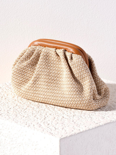 Turn heads everywhere you go this summer with Shiraleah's Sonya Clutch. Made with an elegant woven design and PU details, this bag is a perfect companion to the beach or the bar. Pair with other items from Shiraleah to complete your look!
