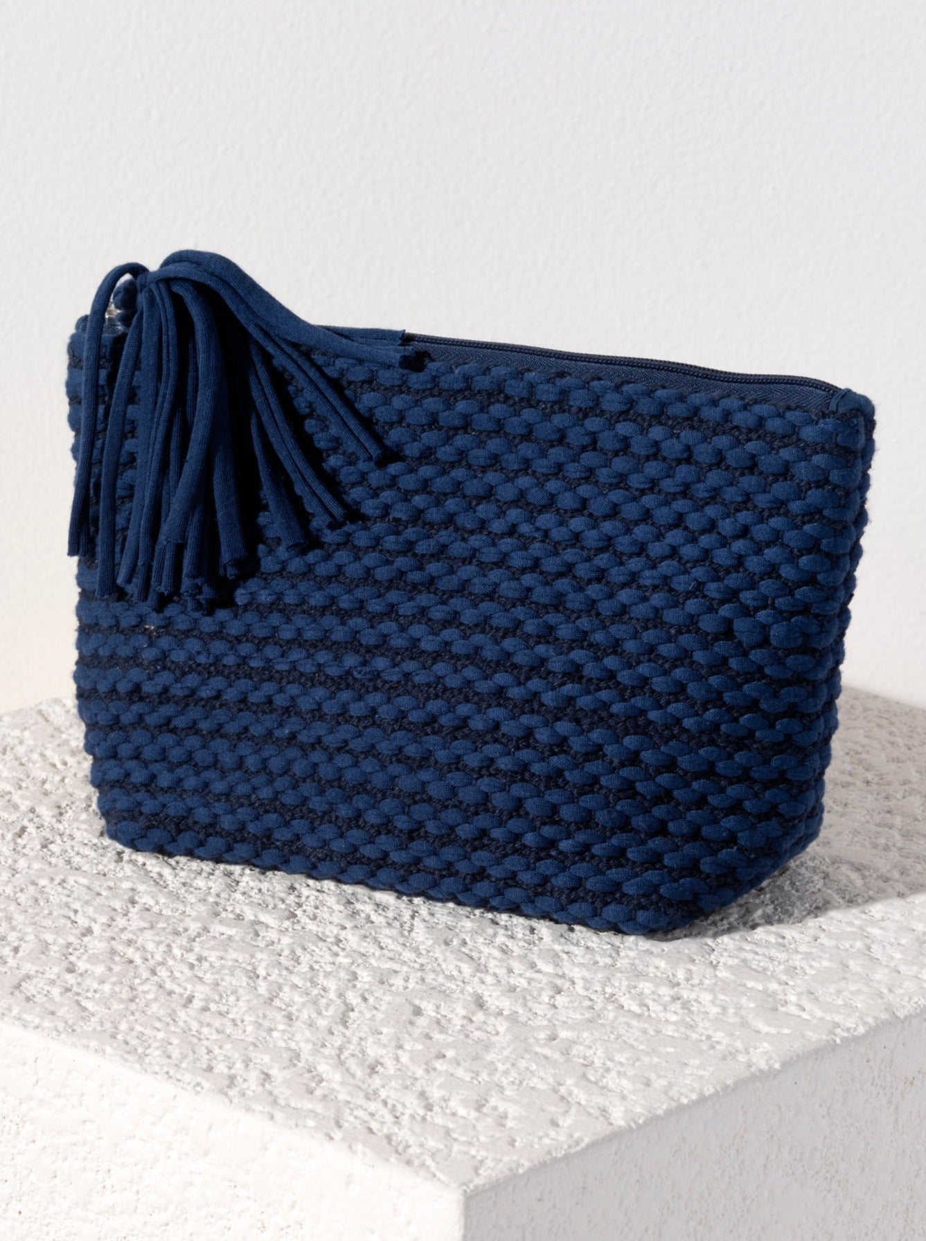 Show off your playful side with Shiraleah's Mavis Zip Pouch. Made from soft woven fabric with a fun tassle detail, this small cosmetic pouch is the perfect size to store all your odds and ends. Pair with the matching Mavis Tote and other items from Shiraleah to complete your look!