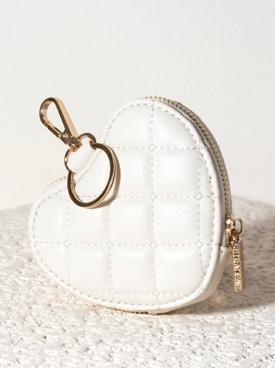 Add a touch of love to any handbag with Shiraleah's Clip-on Sweetheart Zip Pouch. This compact pouch can carry your smallest essentials and easily attaches by key ring or clasp hook. Pair with other items from Shiraleah's Sweetheart collection to complete your look!
