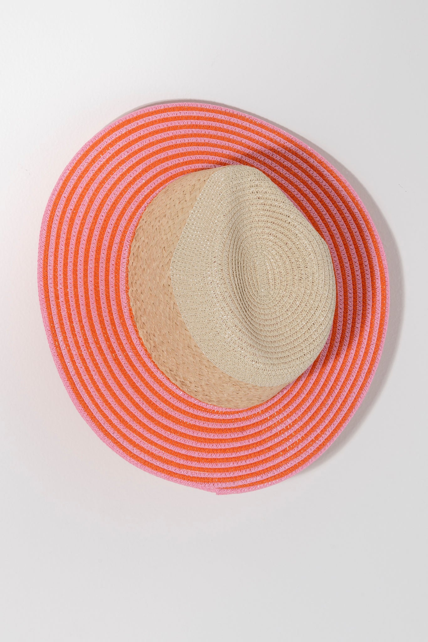 Ensure your face stays shaded this summer with Shiraleah's Armida Hat. Made from a natural paper straw base, this trendy beach hat features a chic orange and pink stripe design on the rim that can match any outfit. Pair with other items from Shiraleah to complete your look!