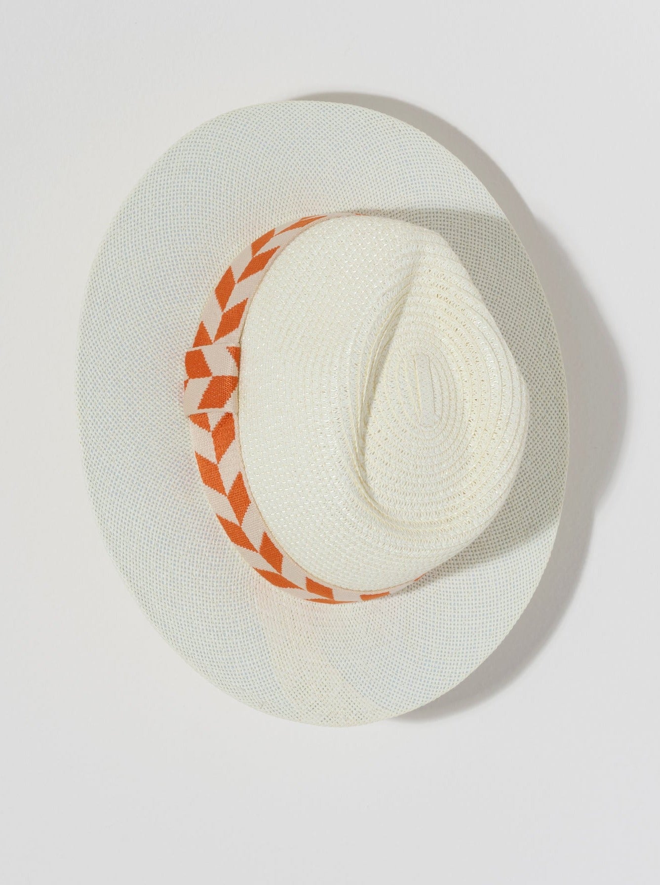 Keep the sunshine out of your eyes this summer with Shiraleah's Aramis Hat. Made from ivory paper straw with an orange patterned stripe, this chic beach hat is the perfect match to any summer outfit. Pair with other items from Shiraleah to complete your look!
