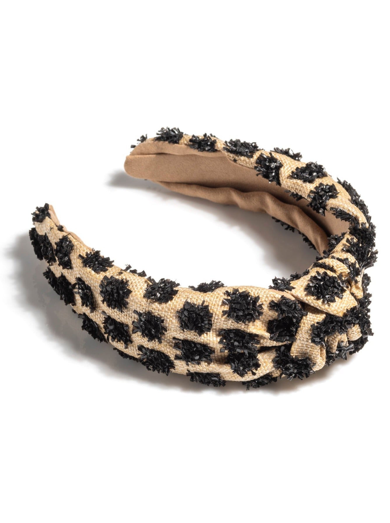 Add an elevated touch to your summer hairstyles with Shiraleah's Tufted Straw Knotted Headband. With its tufted fabric and top knot detail, this chic and trendy headband will be your new favorite summer accessory. Pair with other items from Shiraleah to complete your look!