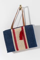 Carry your essentials in style this summer with Shiraleah's Camden Tote. Made from woven paper straw with durable PU sholder straps, this bag is your perfect companion in the sunshine! The classic red, white, and blue color scheme and fun tassle detail invoke the spirit of summer celebrations. Pair with other items from Shiraleah's American Summer collection to complete your look!