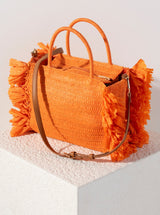 Make your outfit pop with Shiraleah's Sarah Mini Tote handbag. Made from woven paper straw in a vibrant orange color, this bag is the perfect accessory to bring on a picnic or for a night out! Featuring chic circular top handles, the detachable, adjustable cross-body strap allows for versatility in your style. Pair with other items from Shiraleah to complete your look!

