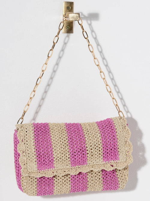 Add some summertime charm to your look with Shiraleah's Sandy Shoulder Bag. Made from woven paper straw with a single gold chain handle, this bag is the perfect transitional piece to wear in the sunshine or out at night. The classic stripe design matches any outfit effortlessly. Pair with other items from Shiraleah to complete your look!
