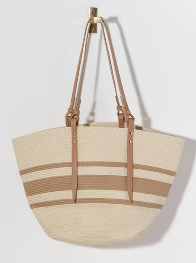 Carry your essentials in style with Shiraleah's practical and versatible Clark Tote. Made from woven paper straw with durable PU shoulder straps, this bag will take you anywhere from the beach to the bar this summer. The classic natural and black color scheme allows it to match any outfit or occasion. Pair with other items from Shiraleah to complete your look!