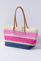 
Ditch your boring beach bag this summer for Shiraleah's Formentera Tote. Made from woven paper straw with durable PU shoulder straps, this bag is your perfect companion to carry all your essentials in style. The bright multicolored pink stripe design makes this the perfect bag to match any warm weather outfit. Pair with the Formentera Zip Pouch and other items from Shiraleah to complete your look!