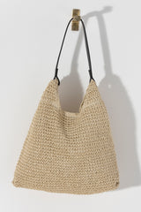 Carry your essentials in style this summer with Shiraleah's Blanca Tote. Made from woven paper straw with a durable PU handle, this chic neutral bag is the perfect accessory for any outfit. Pair with other items from Shiraleah to complete your look!