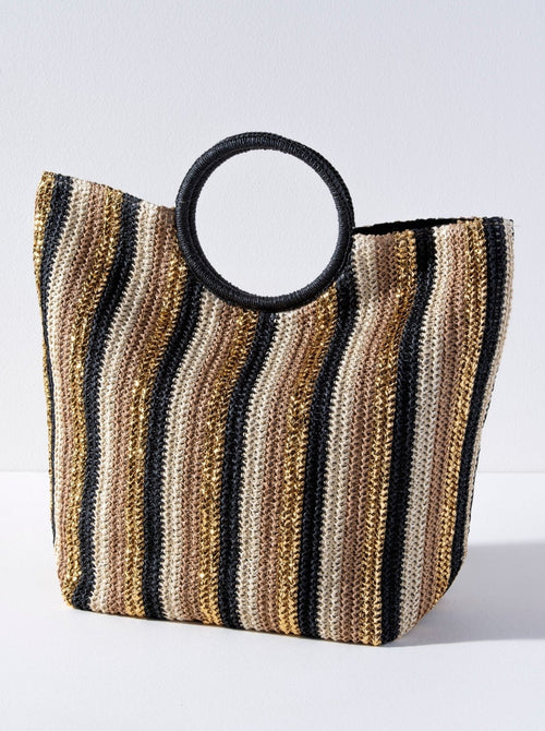 Bring some brightness with you to the beach this summer in Shiraleah's Delilah Tote. Made from woven paper straw with chic circular handles, this tote is the perfect accessory for any warm weather activity. Its black handles match the stripes of black, gold, tan, and natural straw colors creating an elegant color scheme to match your favorite outfit. Pair with the Delilah Zip Pouch and other items from Shiraleah to complete your look! 
