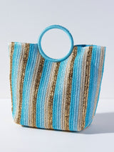 Bring some brightness with you to the beach this summer in Shiraleah's Delilah Tote. Made from woven paper straw with chic circular handles, this tote is the perfect accessory for any warm weather activity. Its turquoise handles match the stripes of turqoise, gold, sky blue, and natural straw colors creating an elegant color scheme to match your favorite outfit. Pair with the Delilah Zip Pouch and other items from Shiraleah to complete your look! 
