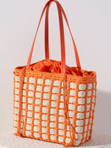 Accessorize with color this summer by carrying Shiraleah's Juanita Tote. Made from woven paper straw with a chic orange cotton lining, this trendy bag will fit your favorite outfit perfectly. The drawstring closure ensures all your items are safely enclosed, while creating a unique silhouette that is sure to stand out from the crowd. Pair with other items from Shiraleah to complete your look!