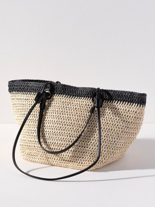 
Carry your essentials in style this summer with Shiraleah's Syracuse Tote. The natural woven paper straw is accented with a stripe of black and features both matching PU handles and shoulder straps to add some versatility to your style. Pair with other items from Shiraleah to complete your look!