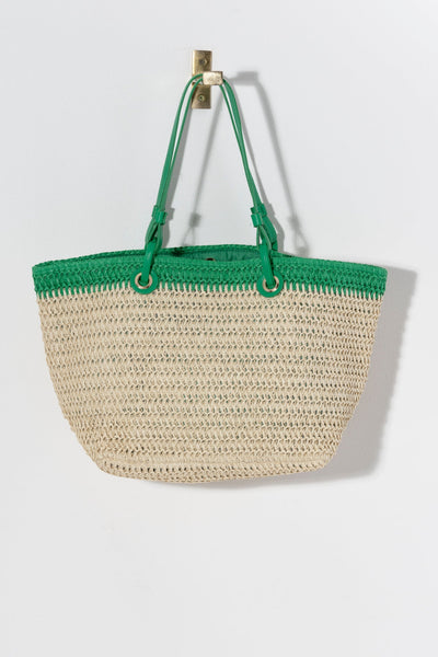 
Carry your essentials in style this summer with Shiraleah's Syracuse Tote. The natural woven paper straw is accented with a stripe of green and features both matching PU handles and shoulder straps to add some versatility to your style. Pair with other items from Shiraleah to complete your look!