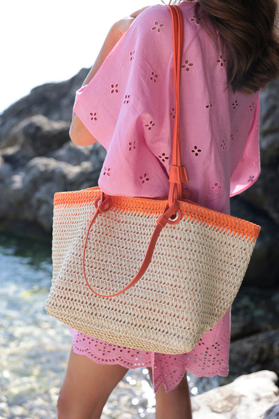 
Carry your essentials in style this summer with Shiraleah's Syracuse Tote. The natural woven paper straw is accented with a stripe of orange and features both matching PU handles and shoulder straps to add some versatility to your style. Pair with other items from Shiraleah to complete your look!
