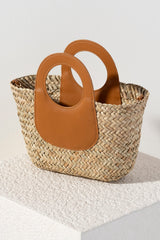 Shiraleah's Palermo Tote is your new summer staple bag. Made from woven sea grass and durable PU top handles, this chic bag is big enough to carry your essentials and stylish enough to add to any outfit. Its detachable cross-body strap allows for versatility in your style. Pair with other items from Shiraleah to complete your look!
