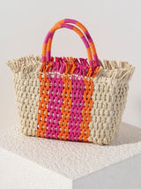 Stand out from the crowd this summer with Shiraleah's Sicily Mini Tote. Made from intricately woven paper straw with sturdy double handles, this bag is both practial and stylish. With its feminine orange and pink striped design it's easy to envision this bag alongside any warm weather outfit. Pair with other items from Shiraleah to complete your look!
