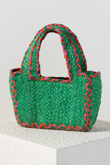 Add a pop of color to your summer outfits with Shiraleah's Liv Small Tote. This compact bag can fit your favorite items and features sturdy double handles. Made from woven jute, the green color is accented with pink and orange stitching to dazzle alongside any outfit. Pair with other items from Shiraleah to complete your look!
