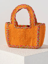 Add a pop of color to your summer outfits with Shiraleah's Liv Small Tote. This compact bag can fit your favorite items and features sturdy double handles. Made from woven jute, the orange color is accented with pink and green stitching to dazzle alongside any outfit. Pair with other items from Shiraleah to complete your look!
