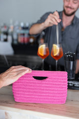Stand out from the crowd this summer with Shiraleah's Josie Clutch. Made from intricately embroidered glass beads with a chic cutout top handle, this handbag is our trendiest accessory yet. The vibrant pink color scheme will add a pop of color to all your favorite summertime outfits. Pair with other items from Shiraleah to complete your look!
