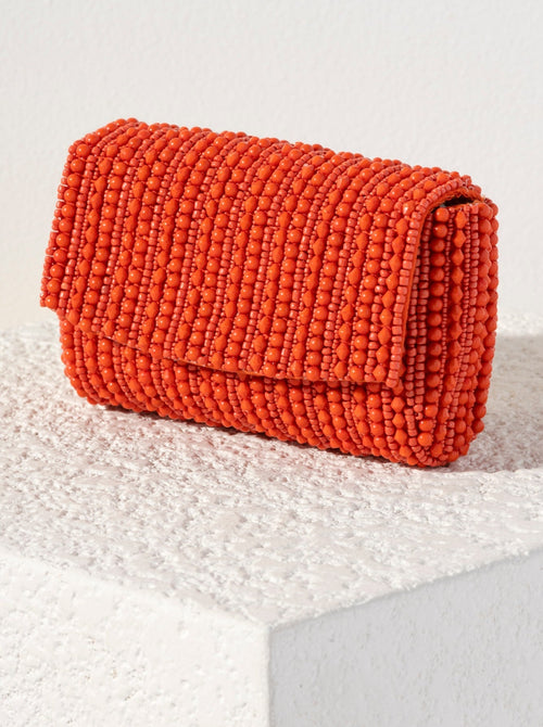 Show off your chicness this summer with Shiraleah's Danny Clutch. Its classic clutch silhouette is intricately embroidered with vibrant orange beads, making it a fun addition for every outfit. Featuring a detachable cross-body chain to add extra versatility to your style. Pair with other items from Shiraleah to complete your look!
