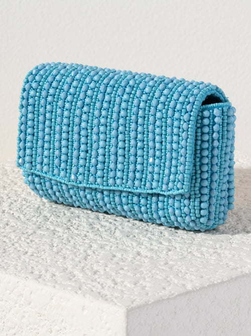Show off your chicness this summer with Shiraleah's Danny Clutch. Its classic clutch silhouette is intricately embroidered with colorful turquoise beads, making it a fun addition for every outfit. Featuring a detachable cross-body chain to add extra versatility to your style. Pair with other items from Shiraleah to complete your look!
