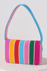 Everyday outfits just got more elegant with Shiraleah's Taylor Shoulder Bag. With its classic baguette silhouette, the purse's exterior is composed entirely of carefully embroidered glass beads. Its vibrant multicolored stripe design allows it to match with every outfit while drawing eyes from all around. Pair with other items from Shiraleah to complete your look!