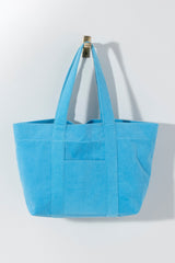 The poolside just got prettier with Shiraleah's Sol Tote. This roomy tote bag has multiple pockets and plenty of space for all of your summer essentials. Made from soft and absorbant cotton terry and available in six vibrant colors, this pool/beach bag will blow all others out of the water. Pair with other items from Shiraleah's Poolside collection to complete your look!
