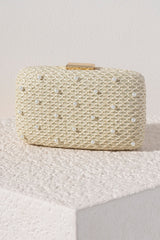 Add a touch of elegance to your summer accessories with Shiraleah's Lola Minaudiere. With a simple netted ivory background, the faux pearl details are the star of the show on this purse. You can carry it as a clutch, or use the detachable cross-body chain to add some versatility to your style. Pair with other items from Shiraleah to complete your look!
