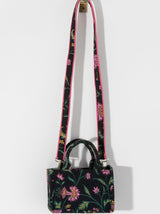 Carry your summer essentials in style with Shiraleah's Luma Mini Tote. This soft but structured canvas bag features a stylish pink and yellow floral design. With double handles and a matching detachable cross-body strap, there are endless ways to wear this purse. Pair with other Shiraleah items to complete your look!
