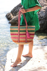 Bring some brightness to the beach this summer with Shiraleah's Fantasia Tote. Made from woven jute with a bright multicolored stripe pattern, this tote is the perfect pool or beachside accessory. Its sturdy double shoulder straps and roomy interior make it as practical as it is fashionable. Pair with the Fantasia Clutch and other items from Shiraleah to complete your look!
