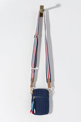 Perfect your on-the-go lifestyle with Shiraleah’s Ezra Phone Holder. This cross-body style bag is perfect for packing light and only carrying the essentials. Featuring a pop of color with the striped adjustable strap and rope zipper-pull detail, this casual accessory will soon become a staple in your wardrobe. Pair with other items from Shiraleah's Ezra collection to complete your look!
