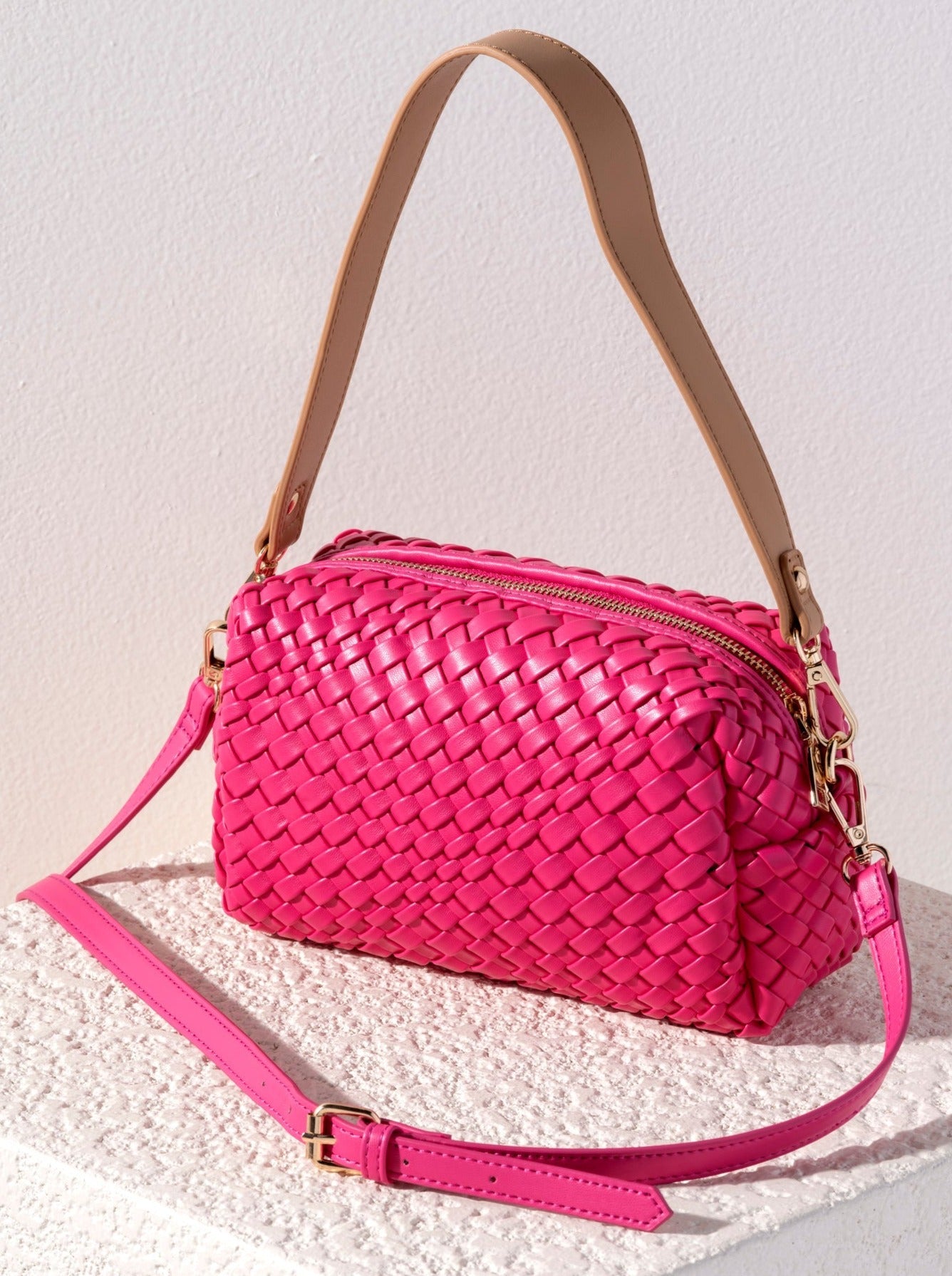 Give your handbag collection a sleek update with Shiraleah's Blythe Boxy Cross Body. Its compact, rectagular body is made from woven vegan leather and adds the perfect pop to any outfit. Add some versatility to your style by using the interchangeable single handle and adjustable cross-body strap. Pair with other items from Shiraleah's Blythe collection to complete your look!