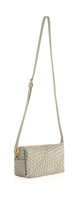 Give your handbag collection a sleek update with Shiraleah's Blythe Boxy Cross Body. Its compact, rectagular body is made from woven vegan leather and adds the perfect pop to any outfit. Add some versatility to your style by using the interchangeable single handle and adjustable cross-body strap. Pair with other items from Shiraleah's Blythe collection to complete your look!