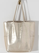 Make a statement this summer with Shiraleah's Maddie Tote. Made from metallic PU, this shiny accessory is sure to turn heads. With double shoulder straps and plenty of storage room, you won't need another bag to get you through this summer. Pair with other Shiraleah items to complete your look!
