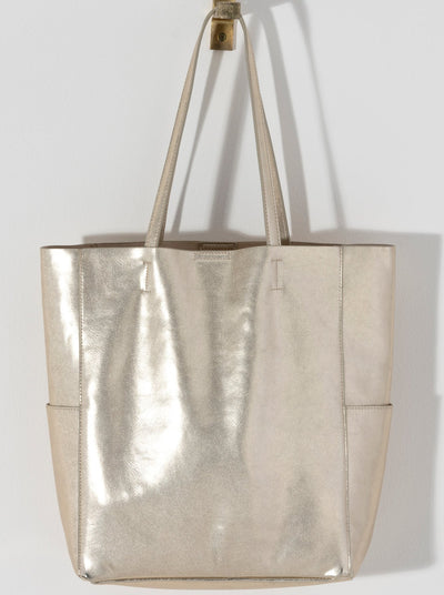 Make a statement this summer with Shiraleah's Maddie Tote. Made from metallic PU, this shiny accessory is sure to turn heads. With double shoulder straps and plenty of storage room, you won't need another bag to get you through this summer. Pair with other Shiraleah items to complete your look!
