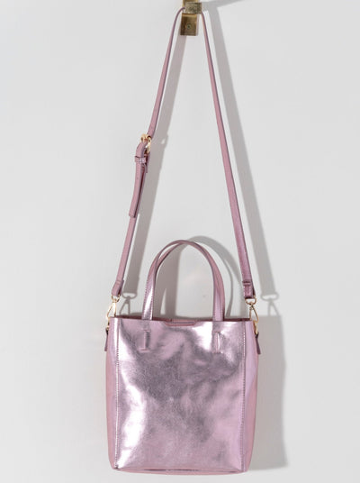 Make a statement this summer with Shiraleah's Maddie Mini Tote. Made from metallic PU, this shiny accessory is sure to turn heads. Add some versatility to your style by wearing with the detachable adjustable cross-body strap or carry with the standard double handles. Pair with other Shiraleah items to complete your look!
