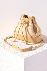 Spruce up your summer wardrobe with Shiraleah's trendy Adrienne Bucket Bag. Made from trendy raffia fabric, the bag's unique silhouette cinches at the top with a drawstring closure. Its cross-body chain makes this bag the perfect addition to any summer outfit. Pair with other items from Shiraleah to complete your look!
