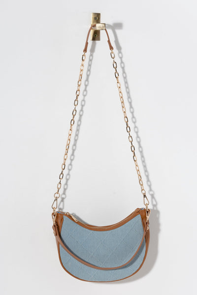 Spruce up your summer wardrobe with Shiraleah's Ali Shoulder Bag. Made from classic denim fabric with sturdy PU details, this bag is a perfect neutral to add to your collection. Add some versatility in how you wear it with its interchangeable single handle and cross-body chain. Pair with other items from Shiraleah to complete your look!
