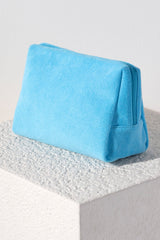 Carry all your odds and ends in style with Shiraleah's Sol Zip Pouch. Made from soft and absorbent cotton terry with a PVC inner lining, this pouch is a perfect companion for the poolside or on the go. Available in a wide range of vibrant colors, you can mix and match with other items from Shiraleah's Sol collection to complete your look!
