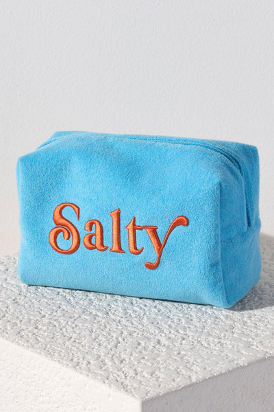 Carry all your odds and ends in style with Shiraleah's Sol "Salty" Zip Pouch. Made from soft and absorbent cotton terry with a PVC inner lining, this pouch is a perfect companion for the poolside or on the go. Its trendy embroidery of the word "Salty" makes it a fun addition to your summer wardrobe. Pair with other items from Shiraleah to complete your look!