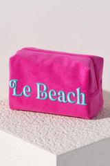 Carry all your odds and ends in style with Shiraleah's Sol "Le Beach" Zip Pouch. Made from soft and absorbent cotton terry with a PVC inner lining, this pouch is a perfect companion for the poolside or on the go. Its trendy embroidery of the words "Le Beach" makes it a fun addition to your summer wardrobe. Pair with other items from Shiraleah to complete your look!
