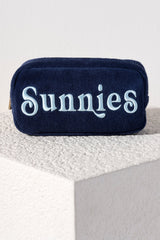 Carry all your odds and ends in style with Shiraleah's Sol "Sunnies" Zip Pouch. Made from soft and absorbent cotton terry with a PVC inner lining, this pouch is a perfect companion for the poolside or on the go. Its trendy embroidery of the word "Sunnies" makes it a fun addition to your summer wardrobe. Pair with other items from Shiraleah to complete your look!