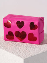 Carry all your odds and ends in style with Shiraleah's Cara Sequin Hearts Zip Pouch. Made of durable polyester in a vibrant pink color, this rectangular case is the perfect size to carry your makeup or toiletries on the go. The trendy sequin embroidery takes the shape of hearts, adding a little love wherever you take it. Pair with other items from Shiraleah to complete your look!
