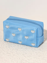 Carry all your odds and ends in Shiraleah's Hearts Zip Pouch. Made of durable polyester in light pink, this rectangular case is the perfect size to sit in a drawer or be carried on the go. The chic embroidered faux pearls take the shape of hearts, adding a little love wherever you take it. Pair with other items from Shiraleah to complete your look!
