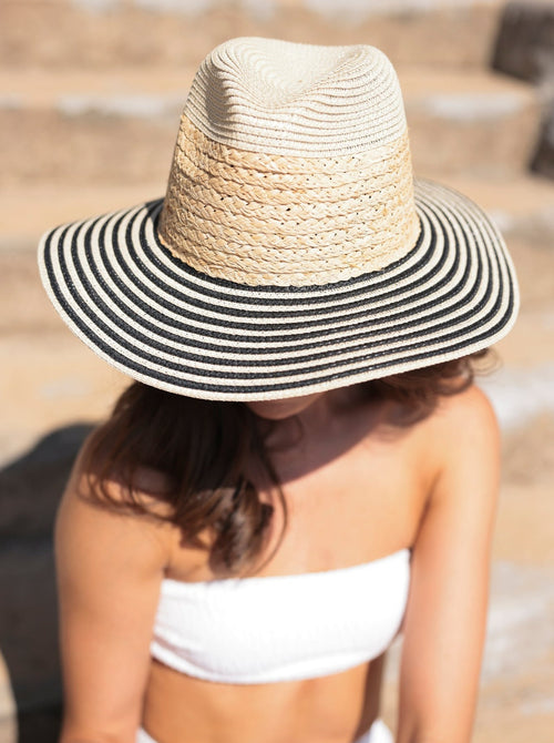 Ensure your face stays shaded this summer with Shiraleah's Armida Hat. Made from a natural paper straw base, this trendy beach hat features a chic black and white stripe design on the rim that can match any outfit. Pair with other items from Shiraleah to complete your look!
