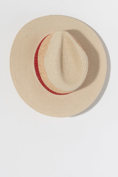 Keep the sunshine out of your eyes this summer with Shiraleah's Alba Hat. Made from natural paper straw and raffia, this elegant woven hat features a red stripe that adds a flair to any beach outfit. Pair with other items from Shiraleah's American Summer collection to complete your look!
