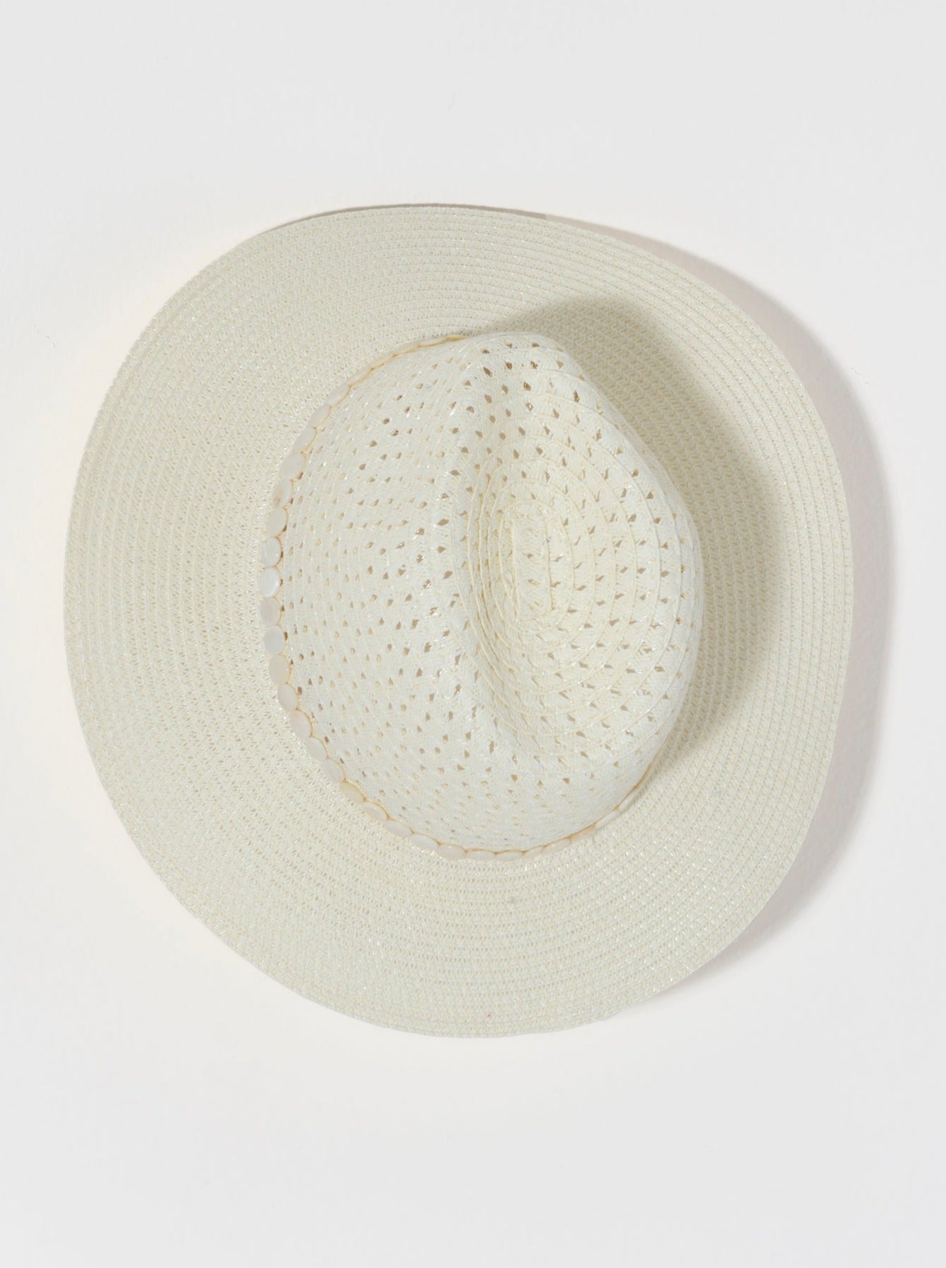 Keep the sunshine out of your eyes this summer with Shiraleah's Astor Hat. Made from ivory paper straw, this elegant woven hat is the perfect accessory to bring to the beach or anywhere the sun shines. Pair with other items from Shiraleah to complete your look!
