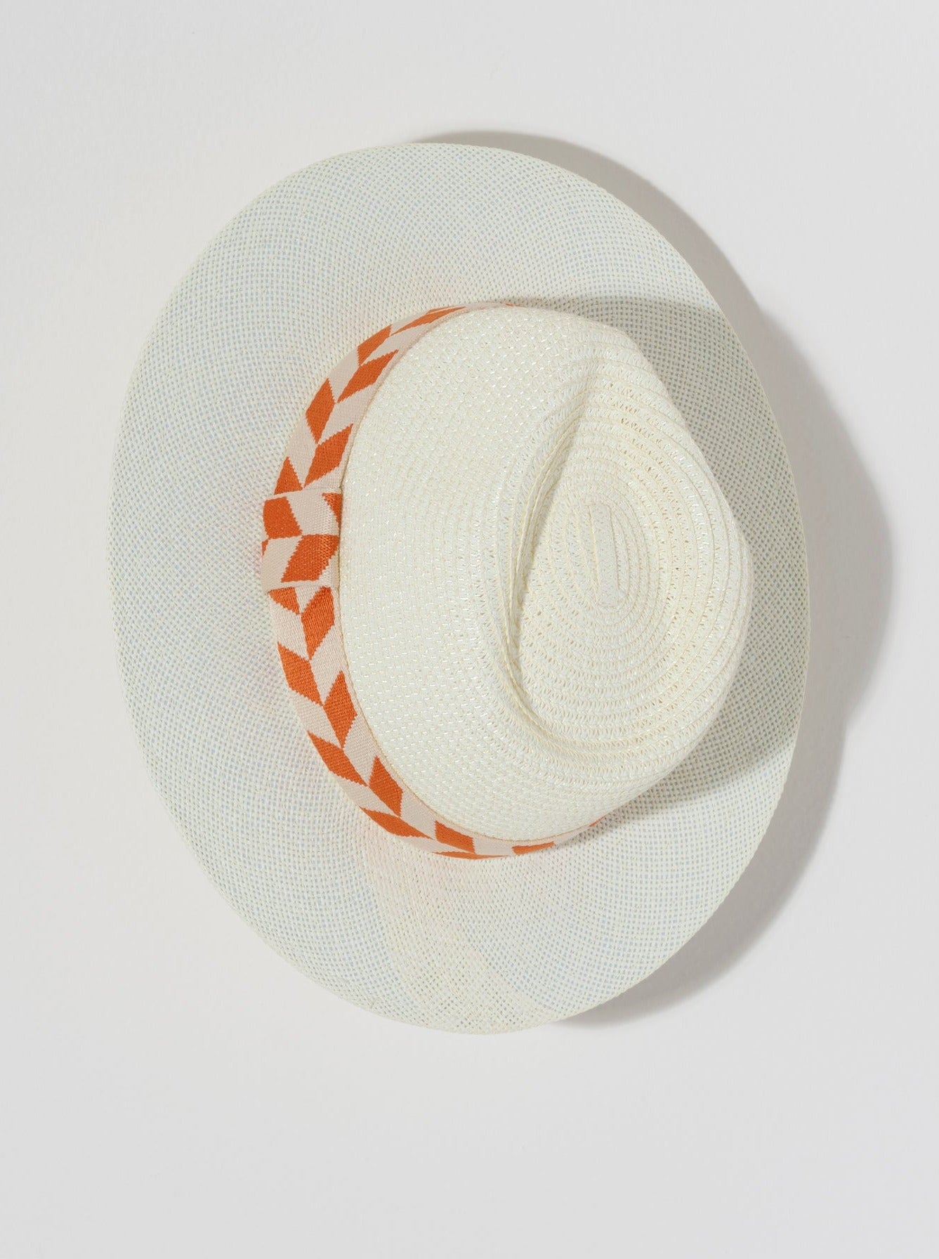 Keep the sunshine out of your eyes this summer with Shiraleah's Aramis Hat. Made from ivory paper straw with an orange patterned stripe, this chic beach hat is the perfect match to any summer outfit. Pair with other items from Shiraleah to complete your look!
